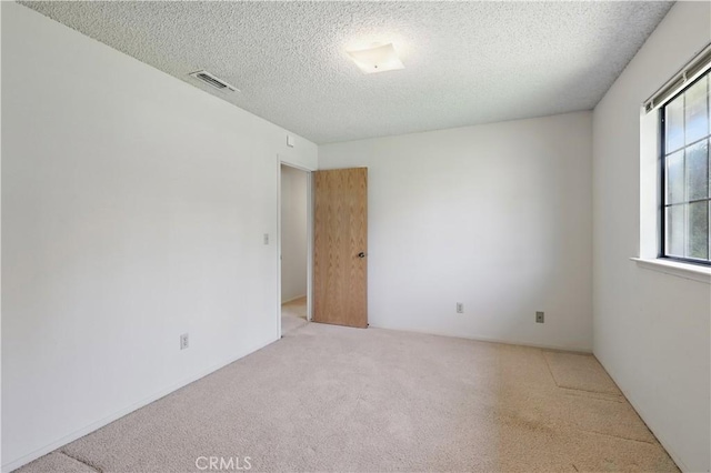 442 R St, Merced, CA 95341 - spare room featuring carpet and a textured ceiling