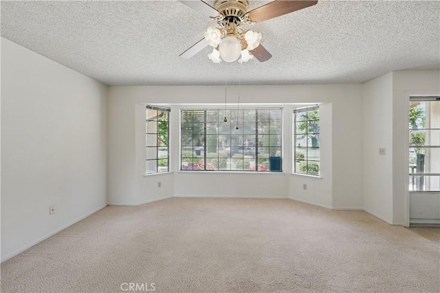 442 R St, Merced, CA 95341 - empty room featuring ceiling fan, carpet, a textured ceiling, and baseboards