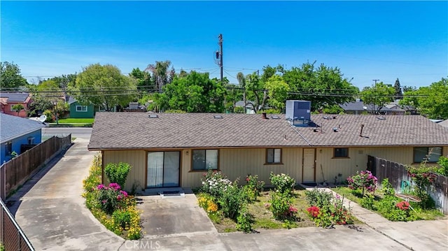 442 R St, Merced, CA 95341 - view of front facade with roof with shingles and central AC unit