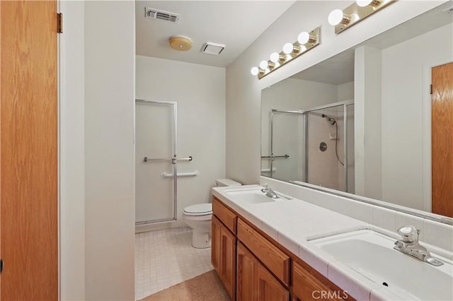 442 R St, Merced, CA 95341 - full bath featuring a stall shower, toilet, and double vanity
