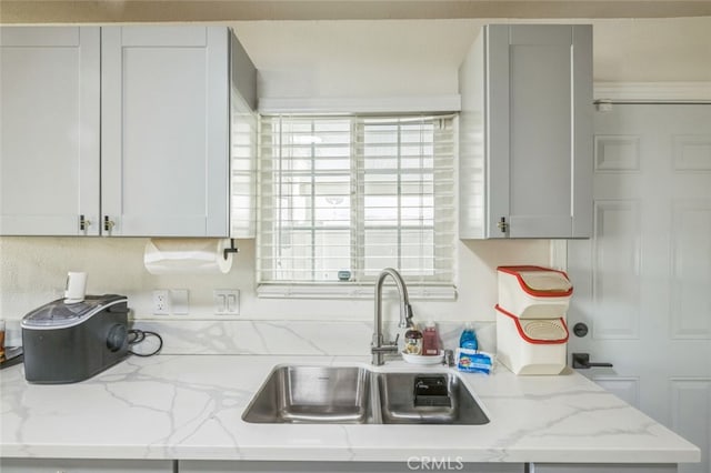 15025 Avenida Ramada, Desert Hot Springs, CA 92240 - kitchen featuring a sink, light stone countertops, and tasteful backsplash