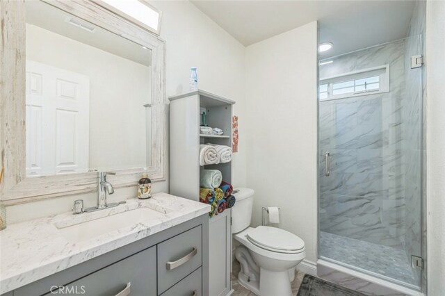15025 Avenida Ramada, Desert Hot Springs, CA 92240 - full bathroom with toilet, a marble finish shower, and vanity