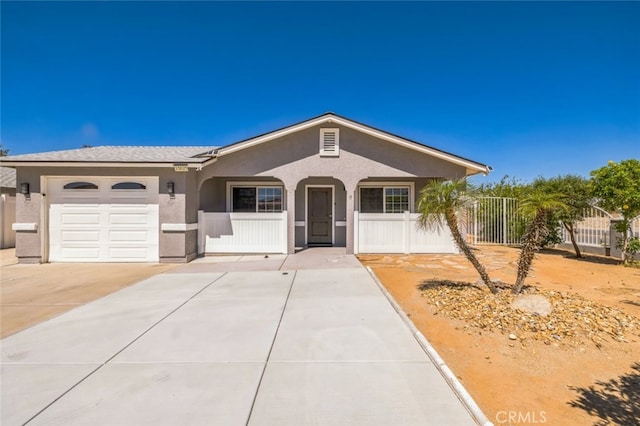 15025 Avenida Ramada, Desert Hot Springs, CA 92240 - view of front of property featuring stucco siding, a garage, fence, and driveway