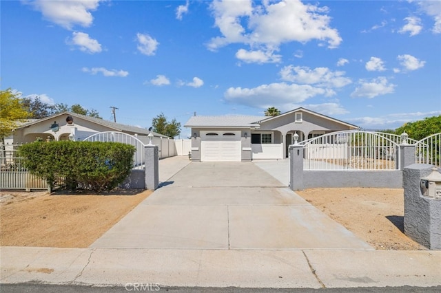 15025 Avenida Ramada, Desert Hot Springs, CA 92240 - ranch-style home featuring a fenced front yard, concrete driveway, a garage, stucco siding, and a gate