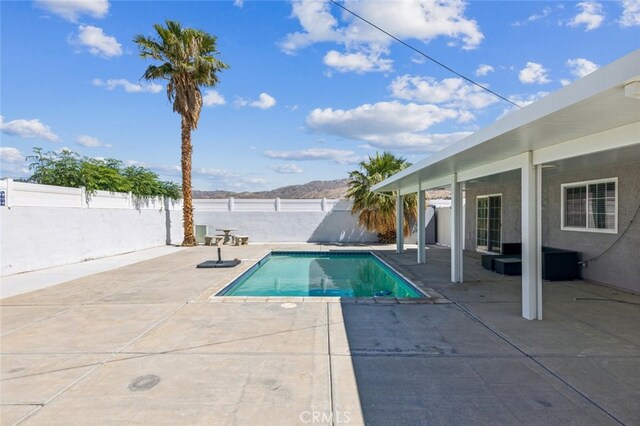 15025 Avenida Ramada, Desert Hot Springs, CA 92240 - view of swimming pool with a patio and a fenced backyard