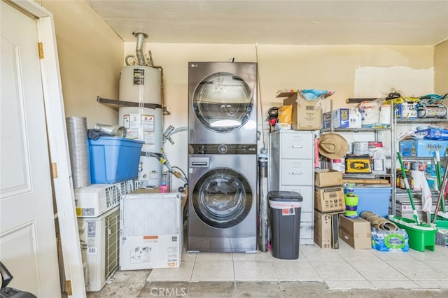 15025 Avenida Ramada, Desert Hot Springs, CA 92240 - laundry room with stacked washer / drying machine, tile patterned flooring, and secured water heater