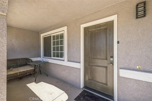 15025 Avenida Ramada, Desert Hot Springs, CA 92240 - doorway to property featuring stucco siding