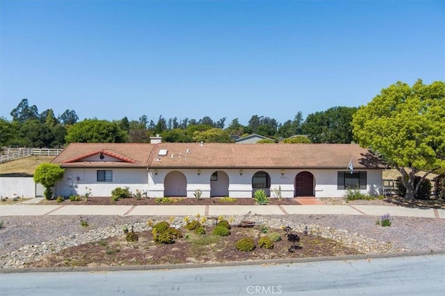 420 Via Vicente, Nipomo, CA 93444 - view of front of home featuring stucco siding and view of wooded area