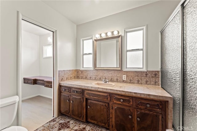 2021 Elanita Dr, San Pedro, CA 90732 - bathroom with toilet, vanity, and tasteful backsplash