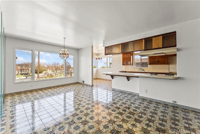 2021 Elanita Dr, San Pedro, CA 90732 - kitchen with a chandelier, healthy amount of natural light, and baseboards
