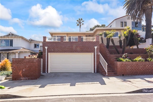 2021 Elanita Dr, San Pedro, CA 90732 - view of front facade with concrete driveway, an attached garage, and stairs