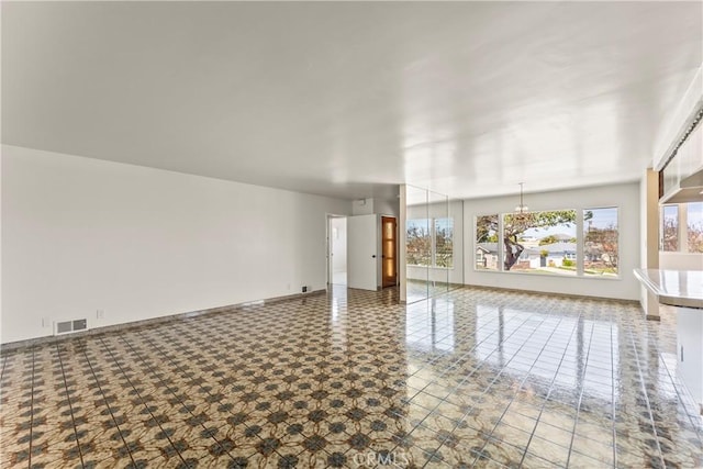 2021 Elanita Dr, San Pedro, CA 90732 - empty room featuring a chandelier and baseboards