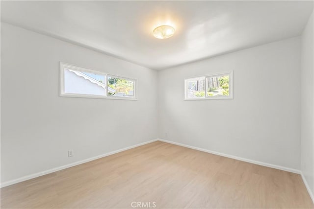 2021 Elanita Dr, San Pedro, CA 90732 - unfurnished room featuring light wood-style flooring, healthy amount of natural light, and baseboards