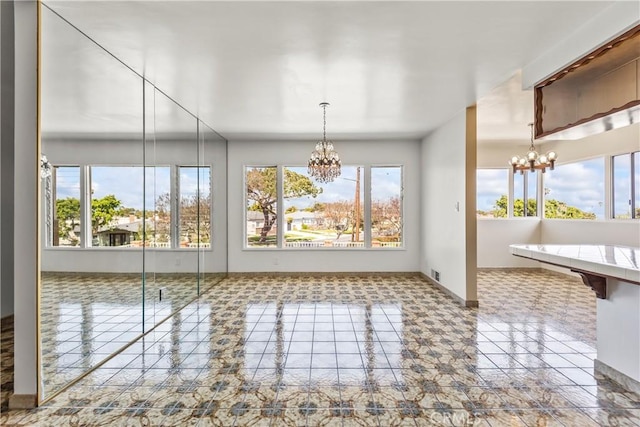 2021 Elanita Dr, San Pedro, CA 90732 - unfurnished dining area with a chandelier, healthy amount of natural light, and baseboards