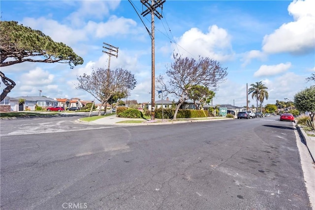 2021 Elanita Dr, San Pedro, CA 90732 - view of asphalt road featuring a residential view, sidewalks, and curbs