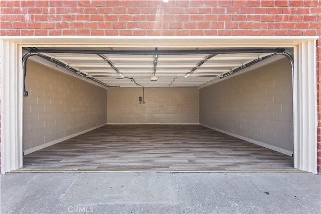 2021 Elanita Dr, San Pedro, CA 90732 - garage featuring baseboards and a garage door opener