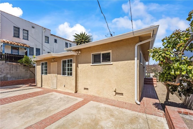 2021 Elanita Dr, San Pedro, CA 90732 - back of property with stucco siding, a patio, and fence