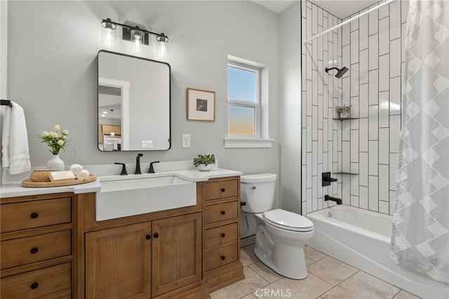bathroom with toilet, tile patterned floors, shower / tub combo, and vanity