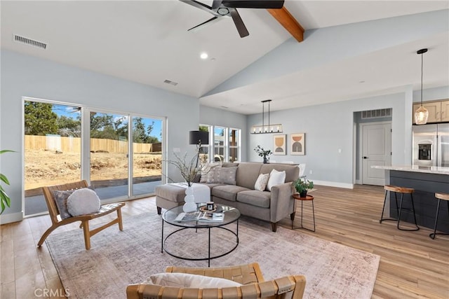 living room featuring beamed ceiling, ceiling fan, light wood-style flooring, recessed lighting, and baseboards
