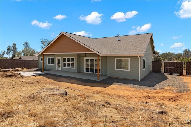 back of property featuring a fenced backyard, a patio, roof with shingles, and ceiling fan