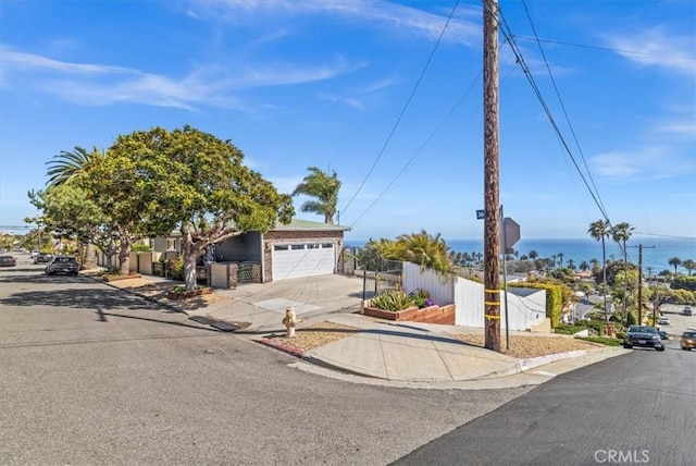 3602 S Walker Ave, San Pedro, CA 90731 - view of front facade featuring driveway, a garage, and fence
