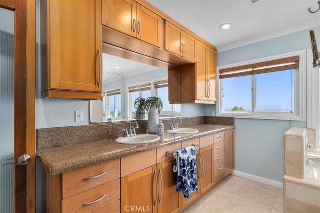 3602 S Walker Ave, San Pedro, CA 90731 - kitchen with a sink, dark countertops, light tile patterned floors, and brown cabinets