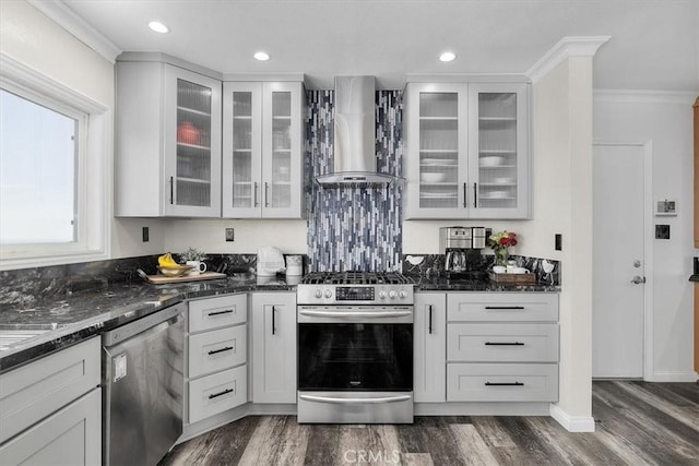 3602 S Walker Ave, San Pedro, CA 90731 - kitchen with wall chimney exhaust hood, appliances with stainless steel finishes, dark stone counters, dark wood-type flooring, and glass insert cabinets