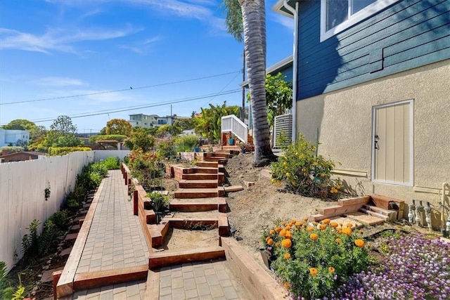 3602 S Walker Ave, San Pedro, CA 90731 - view of yard with stairs, fence, and a vegetable garden