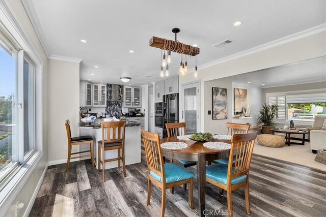 3602 S Walker Ave, San Pedro, CA 90731 - dining area with wood finished floors, recessed lighting, ornamental molding, and baseboards