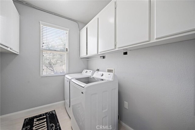 2 Corte Lateuza, Lake Elsinore, CA 92532 - laundry area with washing machine and clothes dryer, cabinet space, and baseboards