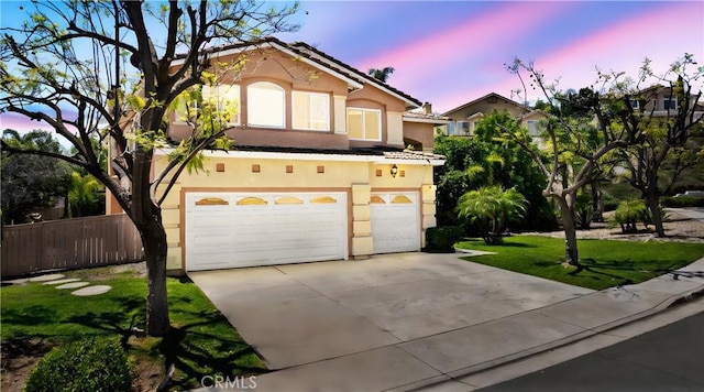 2 Corte Lateuza, Lake Elsinore, CA 92532 - view of front of property featuring an attached garage, stucco siding, concrete driveway, and a tiled roof