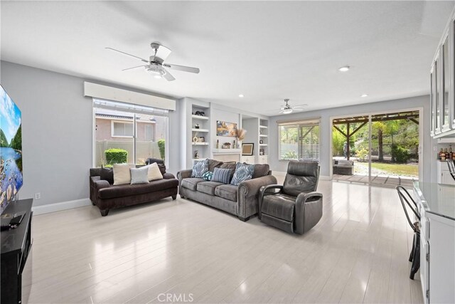 2 Corte Lateuza, Lake Elsinore, CA 92532 - living room with a ceiling fan, light wood-style floors, baseboards, built in features, and recessed lighting