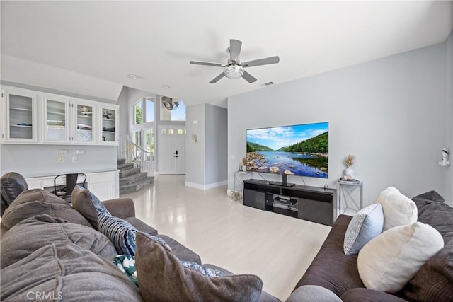 2 Corte Lateuza, Lake Elsinore, CA 92532 - living room featuring baseboards, a ceiling fan, and stairs