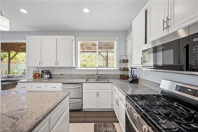 2 Corte Lateuza, Lake Elsinore, CA 92532 - kitchen with appliances with stainless steel finishes, a sink, plenty of natural light, recessed lighting, and white cabinetry