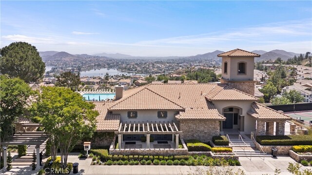 2 Corte Lateuza, Lake Elsinore, CA 92532 - mediterranean / spanish-style house featuring a pergola, a mountain view, a tile roof, and stucco siding
