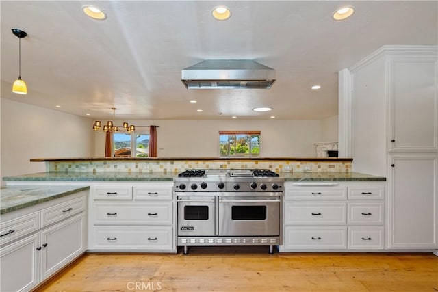 3500 Colima Rd, Atascadero, CA 93422 - kitchen with range with two ovens, recessed lighting, white cabinetry, decorative backsplash, and decorative light fixtures
