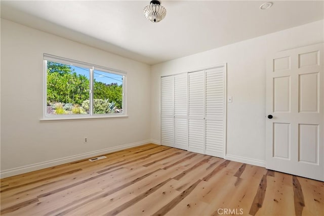 3500 Colima Rd, Atascadero, CA 93422 - unfurnished bedroom featuring baseboards, light wood-type flooring, and a closet