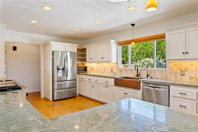 3500 Colima Rd, Atascadero, CA 93422 - kitchen with appliances with stainless steel finishes, a sink, recessed lighting, white cabinetry, and tasteful backsplash