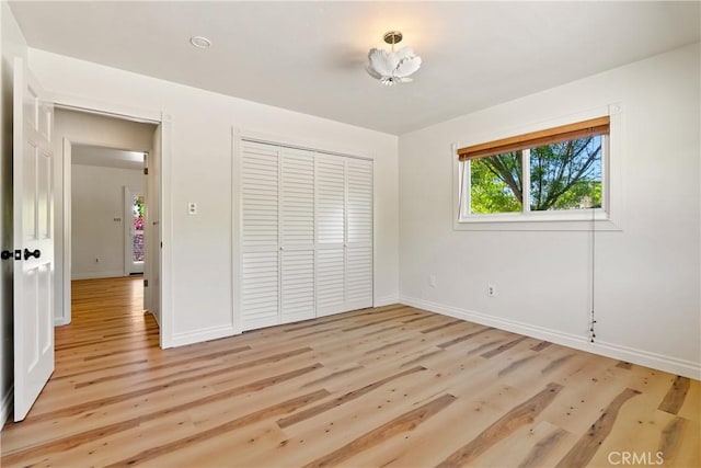3500 Colima Rd, Atascadero, CA 93422 - unfurnished bedroom with baseboards, light wood-style flooring, and a closet