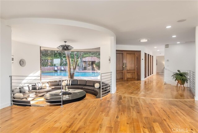 3828 Alomar Dr, Sherman Oaks, CA 91423 - sunken living room featuring hardwood / wood-style floors, recessed lighting, baseboards, and arched walkways