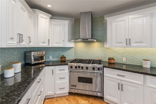 3828 Alomar Dr, Sherman Oaks, CA 91423 - kitchen with premium range, wall chimney range hood, white cabinets, and recessed lighting