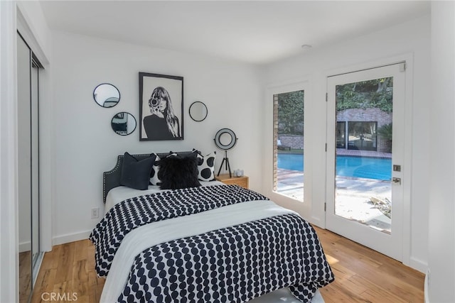 3828 Alomar Dr, Sherman Oaks, CA 91423 - bedroom featuring access to exterior and light wood-style flooring