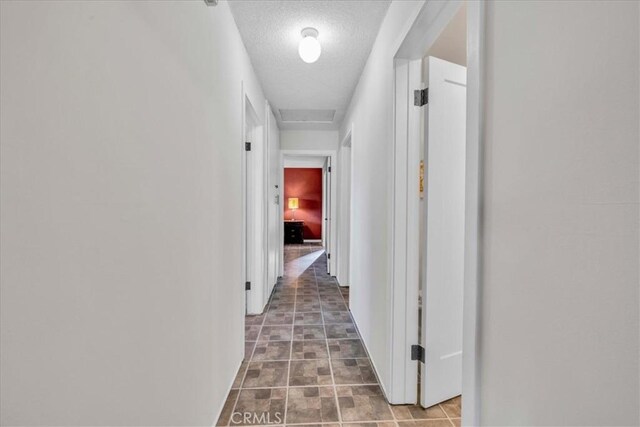 56772 Kismet Rd, Yucca Valley, CA 92284 - hall with a textured ceiling and baseboards