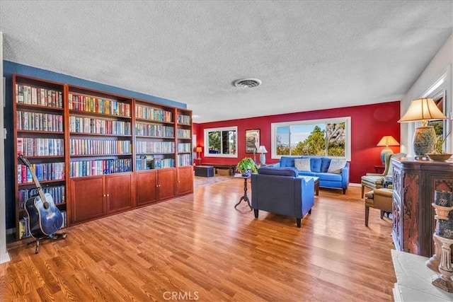 56772 Kismet Rd, Yucca Valley, CA 92284 - living room with wood finished floors and a textured ceiling