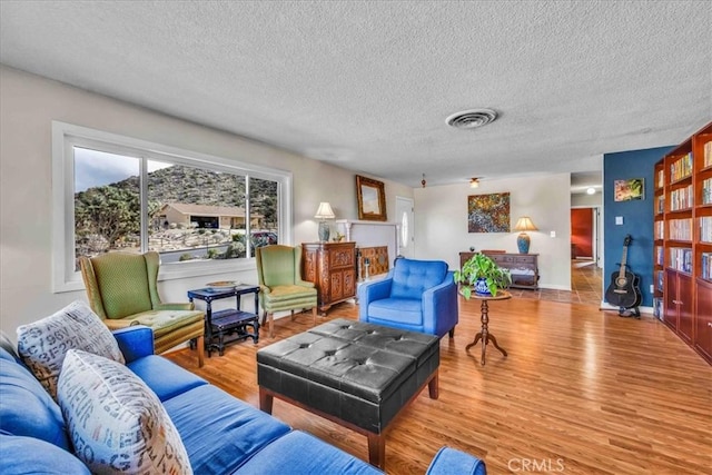 56772 Kismet Rd, Yucca Valley, CA 92284 - living room with wood finished floors and a textured ceiling