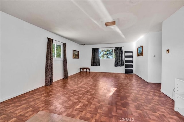 56772 Kismet Rd, Yucca Valley, CA 92284 - empty room with plenty of natural light and baseboards