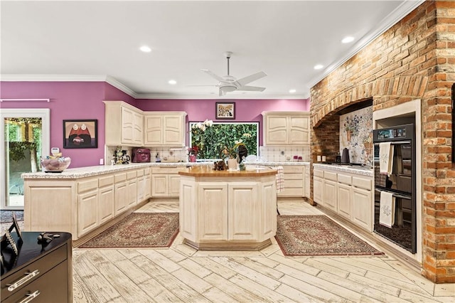 4960 Densmore Ave, Encino, CA 91436 - kitchen featuring a peninsula, ceiling fan, tasteful backsplash, light wood finished floors, and crown molding