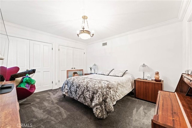 4960 Densmore Ave, Encino, CA 91436 - bedroom with carpet, two closets, and crown molding