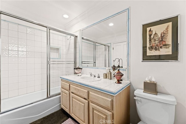 4960 Densmore Ave, Encino, CA 91436 - bathroom featuring toilet, ornamental molding, vanity, enclosed tub / shower combo, and recessed lighting