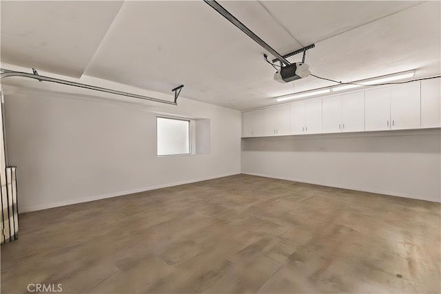 4960 Densmore Ave, Encino, CA 91436 - garage with a garage door opener and baseboards